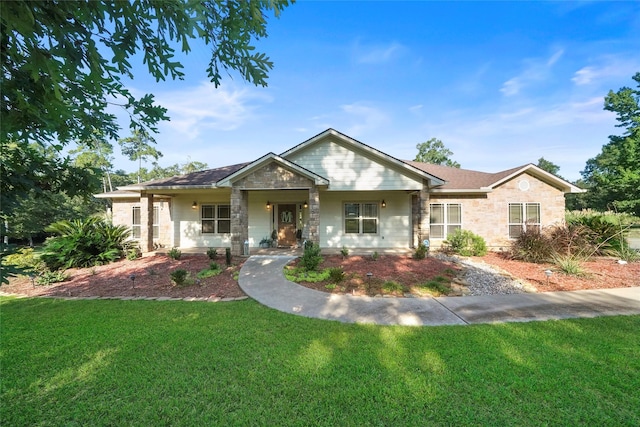 view of front of house with a porch and a front yard