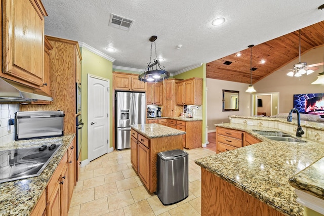 kitchen featuring a large island, sink, pendant lighting, lofted ceiling, and black appliances