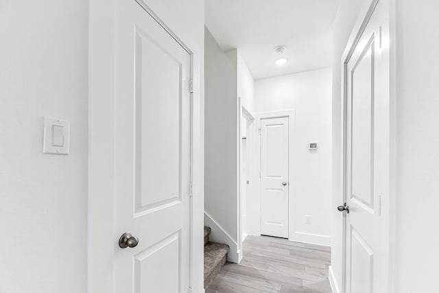 hall with light hardwood / wood-style floors