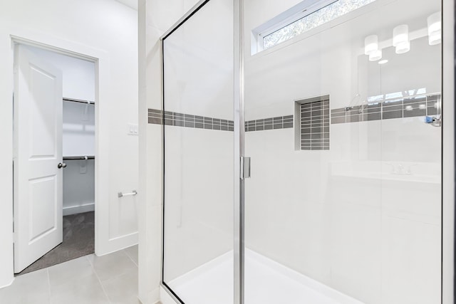 bathroom featuring tile patterned flooring and walk in shower