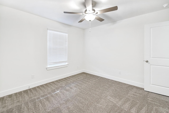 empty room with ceiling fan and carpet floors