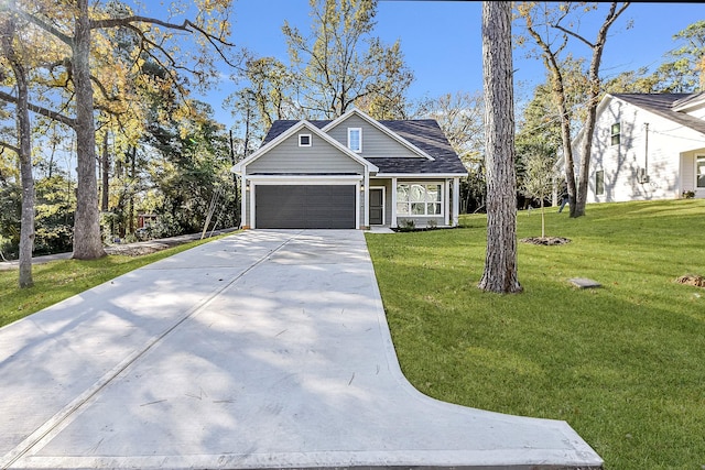 view of front facade featuring a front yard and a garage