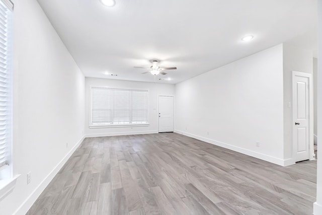 interior space featuring light hardwood / wood-style floors and ceiling fan