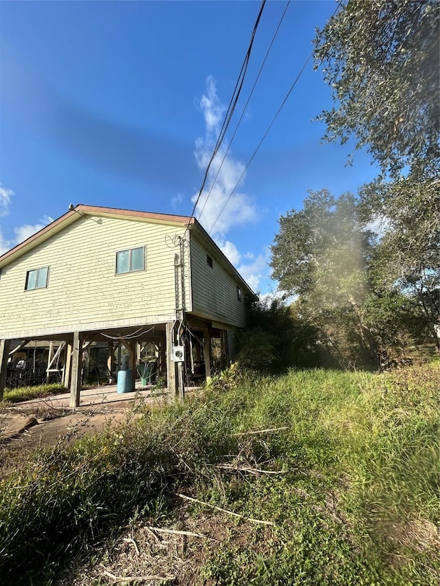 rear view of property with a carport