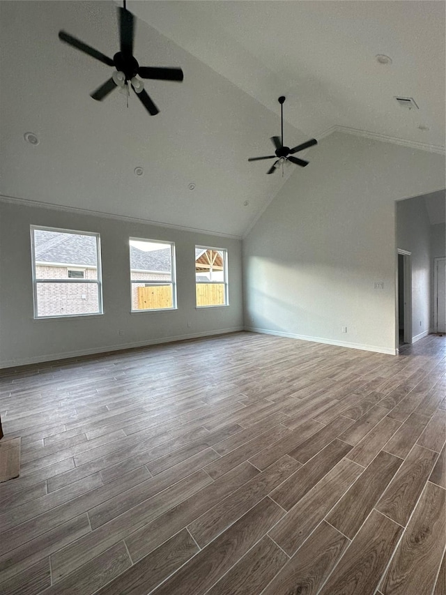 unfurnished living room featuring dark hardwood / wood-style floors, high vaulted ceiling, and ceiling fan