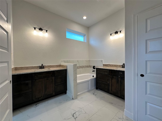 bathroom with a bathtub and vanity