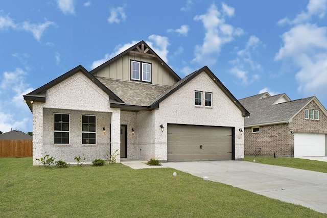 114 Little Spring Ct, Anahuac, TX 77514 - view of front facade with board and batten siding, driveway, roof with shingles, brick siding, and a garage