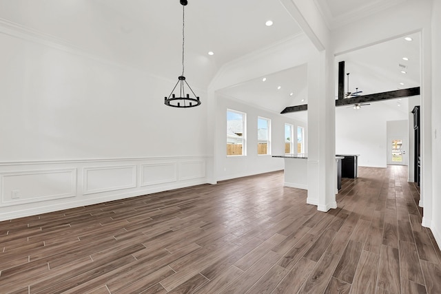 114 Little Spring Ct, Anahuac, TX 77514 - unfurnished dining area featuring a chandelier, vaulted ceiling, dark wood-style floors, crown molding, and recessed lighting