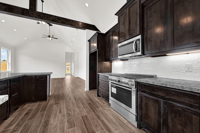 114 Little Spring Ct, Anahuac, TX 77514 - kitchen with stainless steel appliances, stone countertops, a ceiling fan, dark wood finished floors, and recessed lighting