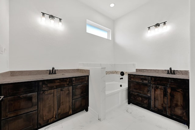 114 Little Spring Ct, Anahuac, TX 77514 - bathroom featuring vanity, marble finish floors, and a bath