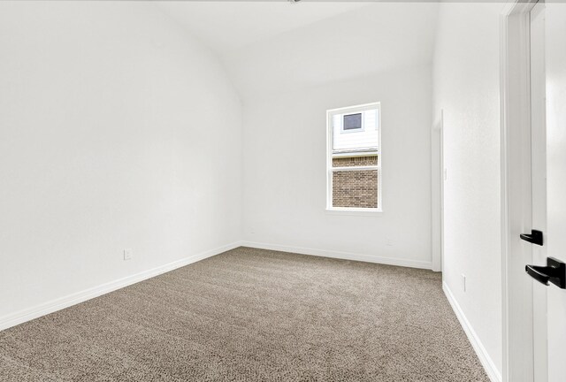 114 Little Spring Ct, Anahuac, TX 77514 - unfurnished room with carpet floors, vaulted ceiling, and baseboards