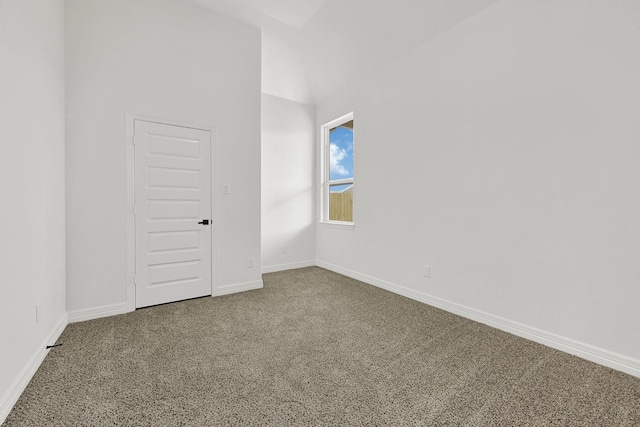 114 Little Spring Ct, Anahuac, TX 77514 - carpeted empty room featuring baseboards and a high ceiling