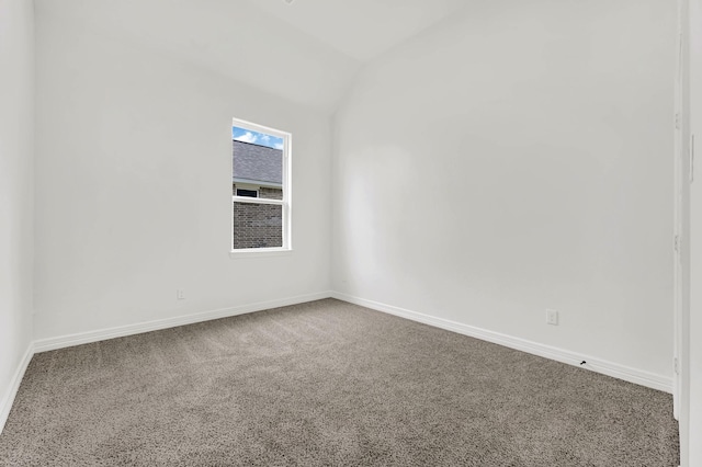 114 Little Spring Ct, Anahuac, TX 77514 - spare room with carpet floors, lofted ceiling, and baseboards