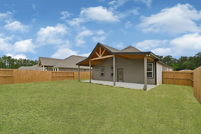 114 Little Spring Ct, Anahuac, TX 77514 - back of house featuring a patio area