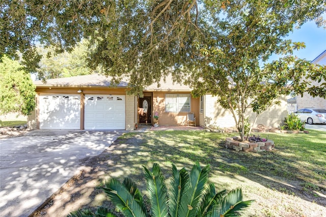 ranch-style house with a garage and a front lawn