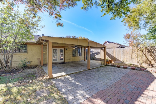 view of patio featuring ceiling fan and french doors