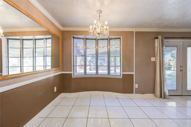 unfurnished dining area featuring french doors, a healthy amount of sunlight, and ornamental molding