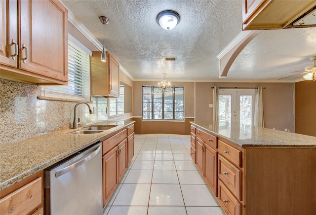 kitchen featuring stainless steel dishwasher, ornamental molding, sink, light tile patterned floors, and decorative light fixtures