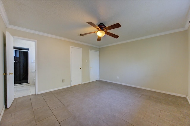 empty room with a textured ceiling, ceiling fan, and crown molding