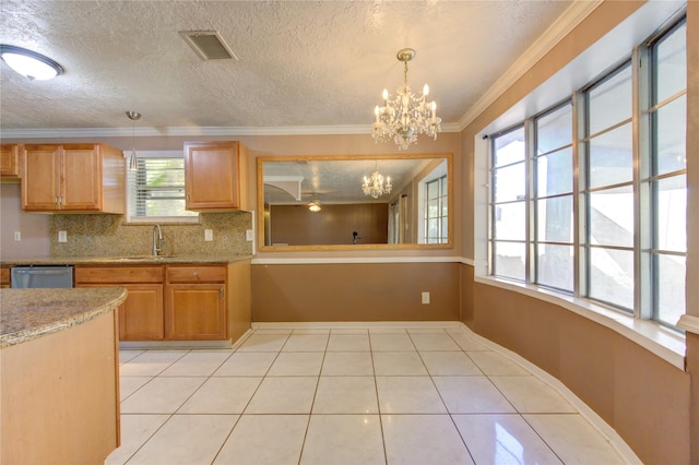 kitchen featuring stainless steel dishwasher, crown molding, light tile patterned floors, a notable chandelier, and hanging light fixtures