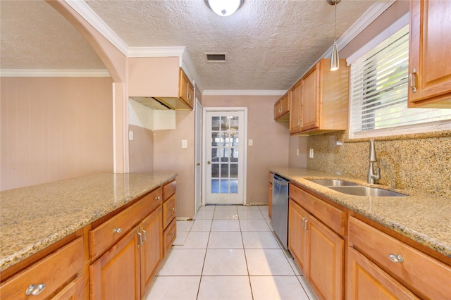 kitchen featuring stainless steel dishwasher, pendant lighting, ornamental molding, and sink