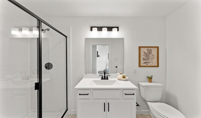 full bathroom featuring toilet, vanity, and a shower stall