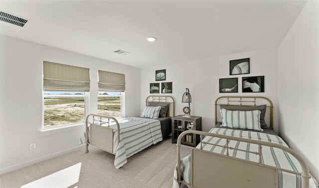 bedroom featuring recessed lighting, visible vents, light carpet, and baseboards