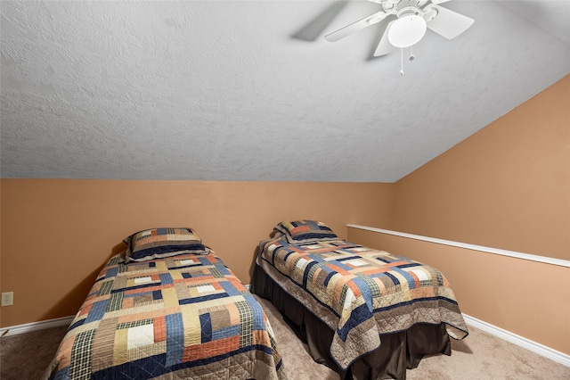 bedroom with a textured ceiling, light colored carpet, ceiling fan, and lofted ceiling