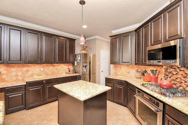 kitchen featuring decorative backsplash, ornamental molding, appliances with stainless steel finishes, decorative light fixtures, and dark brown cabinetry