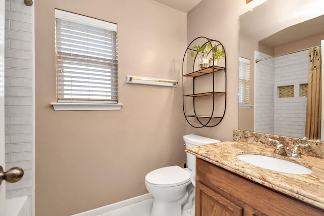 full bathroom featuring tile patterned floors, vanity, toilet, and tiled shower / bath combo