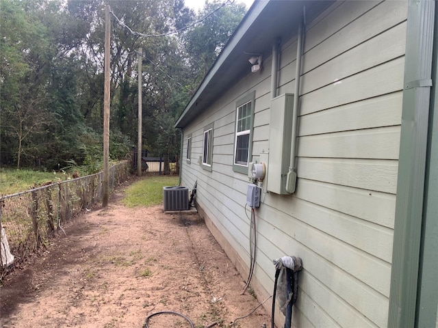 view of side of property with cooling unit