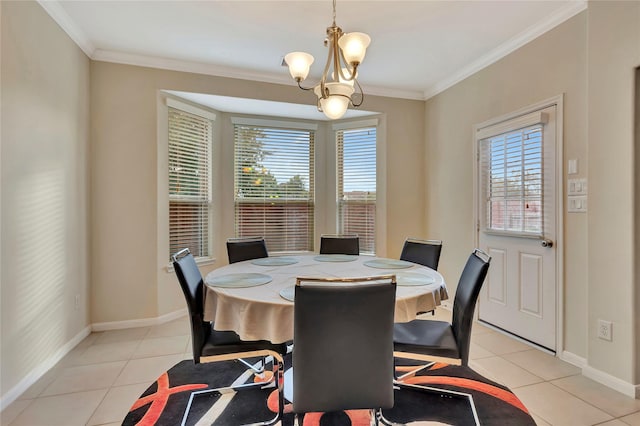 tiled dining area featuring crown molding, a healthy amount of sunlight, and a notable chandelier