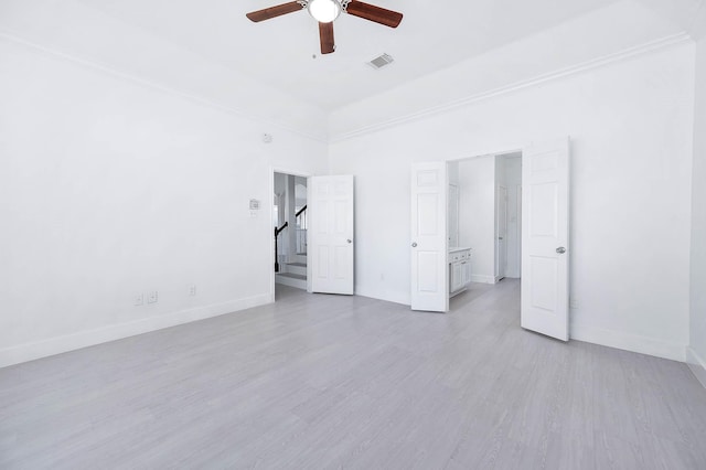 unfurnished bedroom with light hardwood / wood-style floors, ceiling fan, and ornamental molding