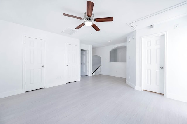 unfurnished room with ceiling fan and light wood-type flooring