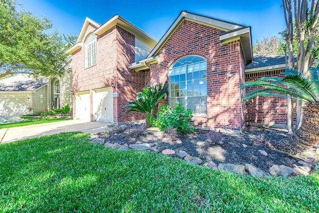 view of property featuring a front yard and a garage