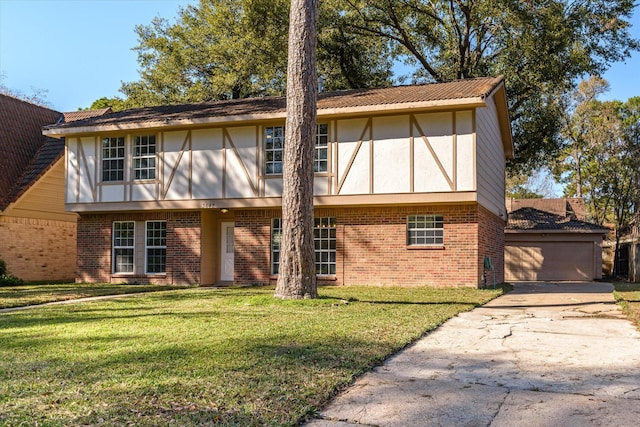 tudor house with a front lawn and a garage