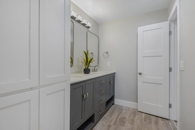 bathroom featuring vanity and hardwood / wood-style flooring