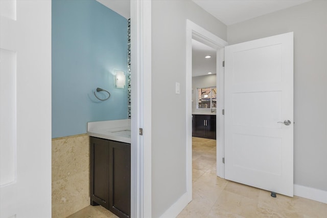 bathroom with tile patterned flooring and vanity