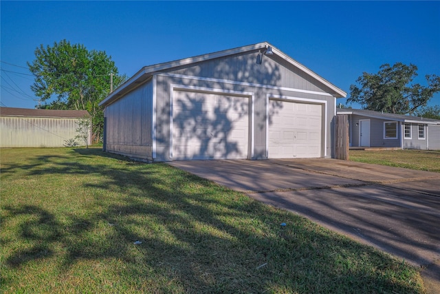 garage with a yard