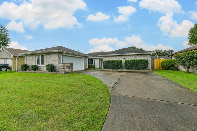 single story home with a front yard and a garage