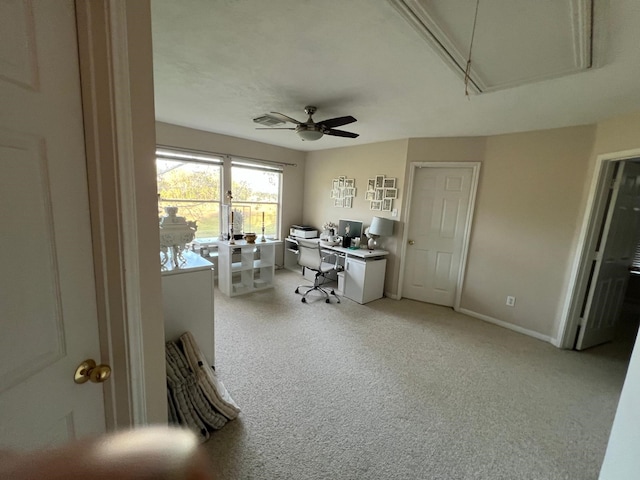 office space featuring ceiling fan and light carpet