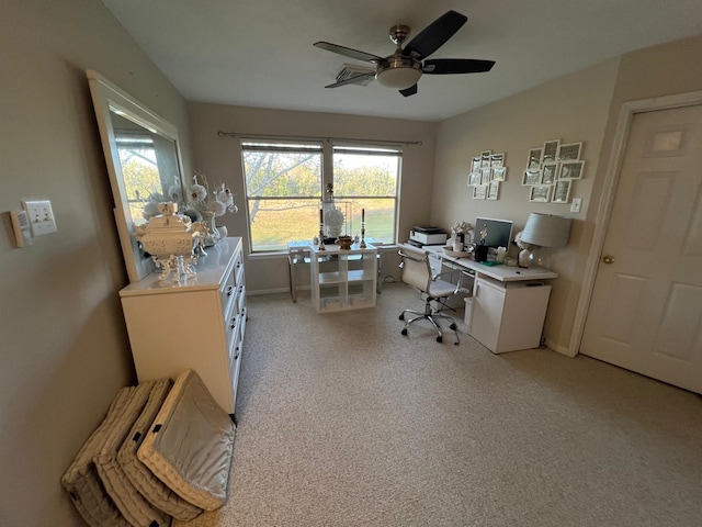 office space with light carpet and ceiling fan