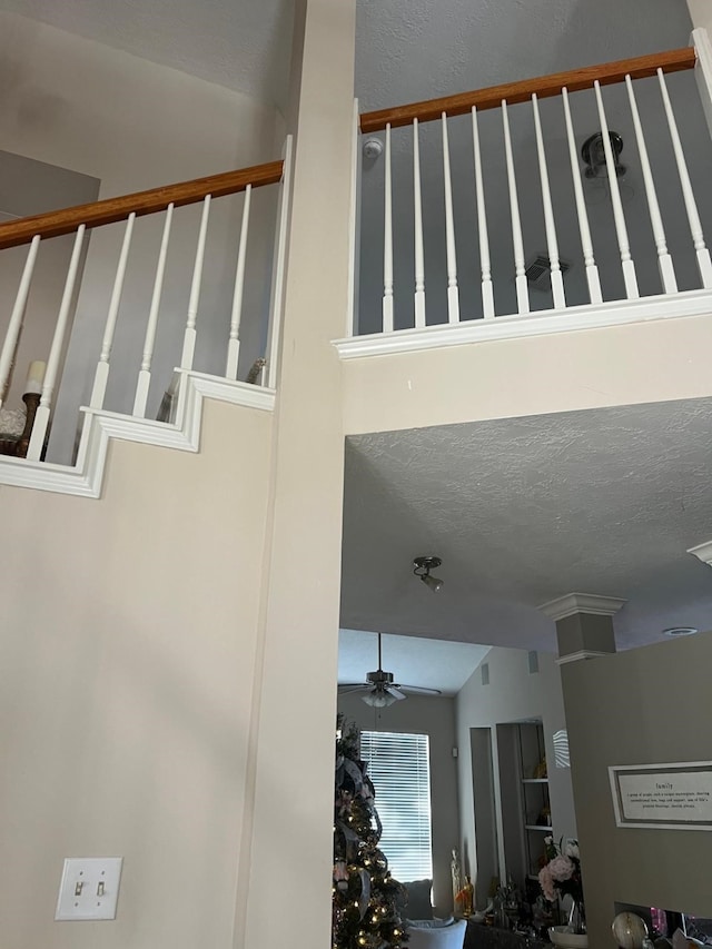 details with a textured ceiling and ceiling fan