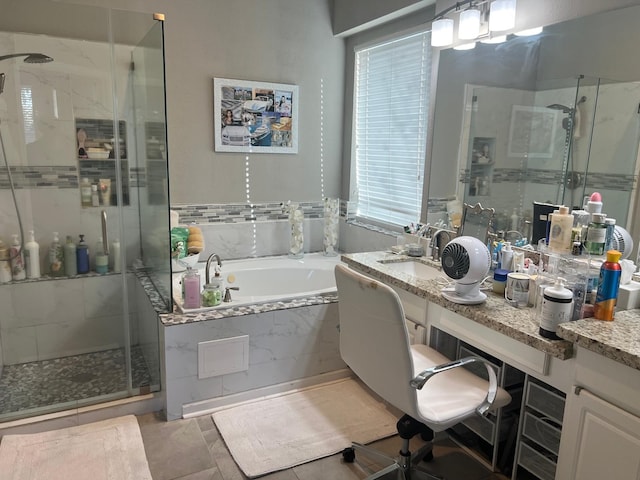 bathroom featuring tile patterned floors, vanity, and independent shower and bath