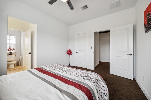 carpeted bedroom with ceiling fan and ensuite bathroom