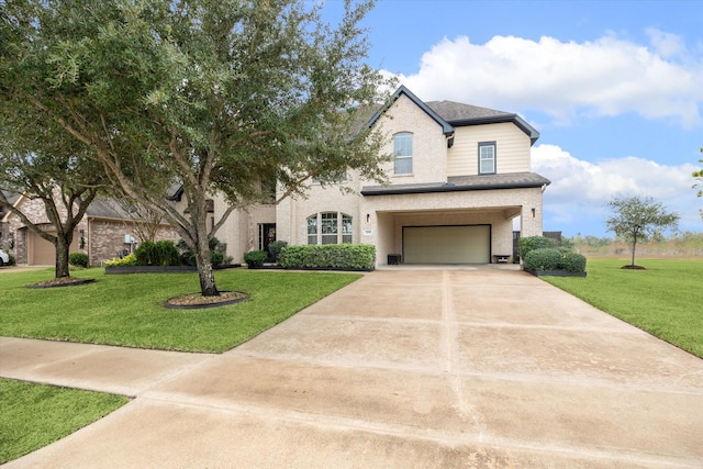 view of front of property featuring a garage and a front lawn