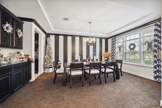 carpeted dining area featuring a notable chandelier and a raised ceiling