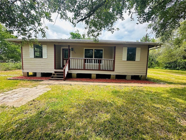 view of front of house with a porch and a front lawn