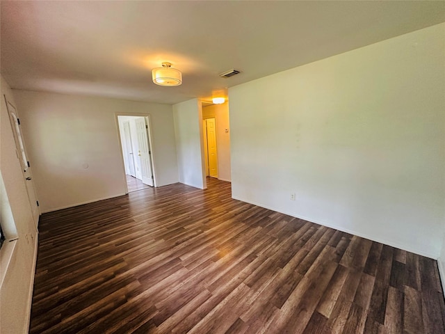 unfurnished room featuring dark hardwood / wood-style floors