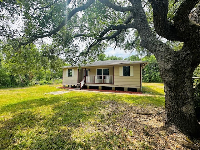 rear view of house with a lawn